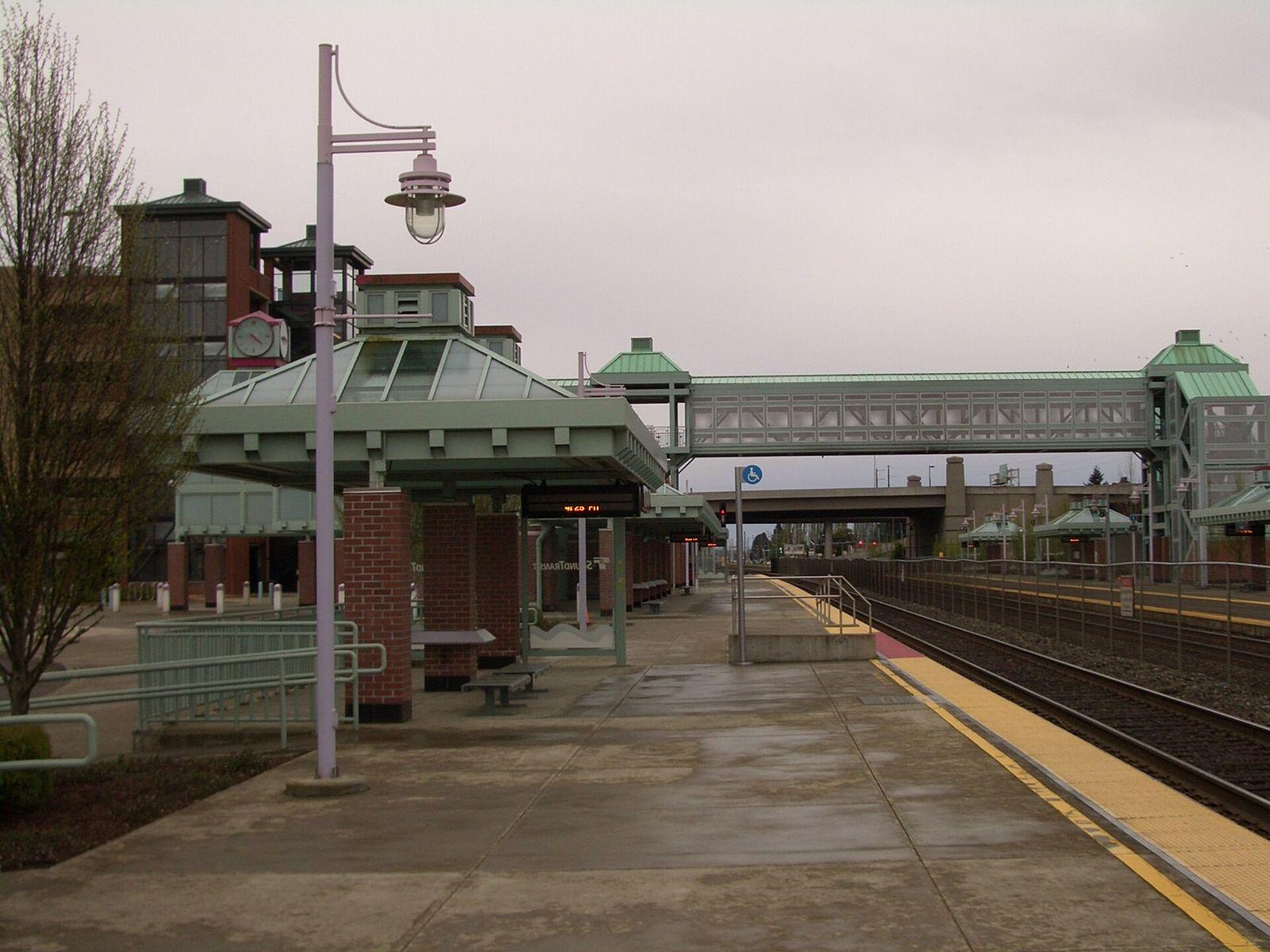 Auburn Sounder commuter rail station platform with a covered shelter and pedestrian bridge
